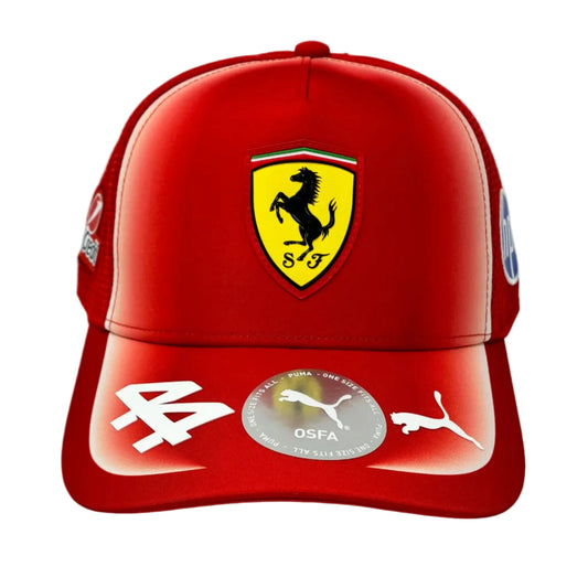 A red Ferrari baseball cap featuring the yellow Scuderia Ferrari shield logo on the front, with white Puma logos on the brim and a circular OSFA sticker in the center.